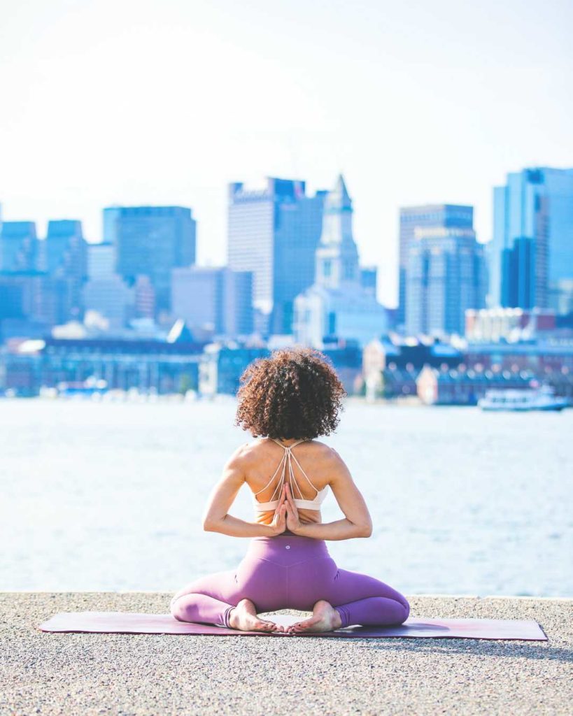 A woman doing a yoga pose dealing with stress as a film actor | FILMD